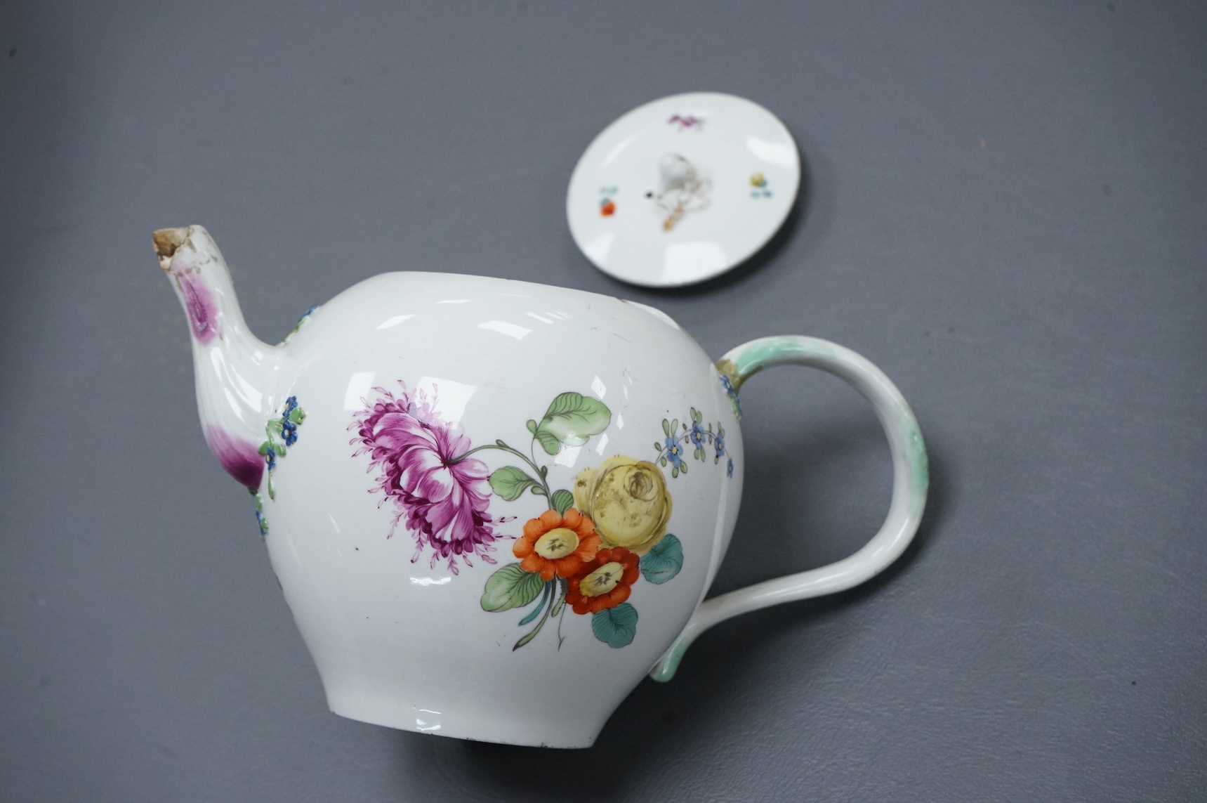 The Hague, a late 18th century soft paste porcelain teapot, painted with polychrome flowers, 12cm high